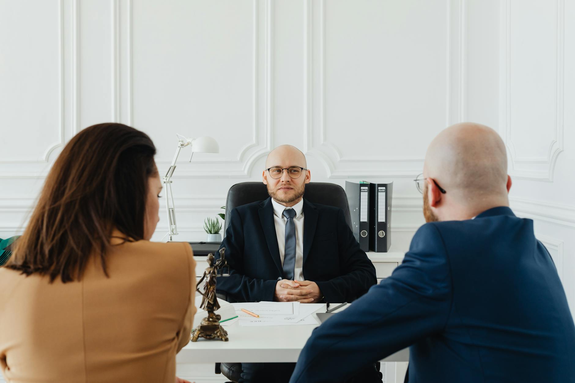 a couple consulting a lawyer